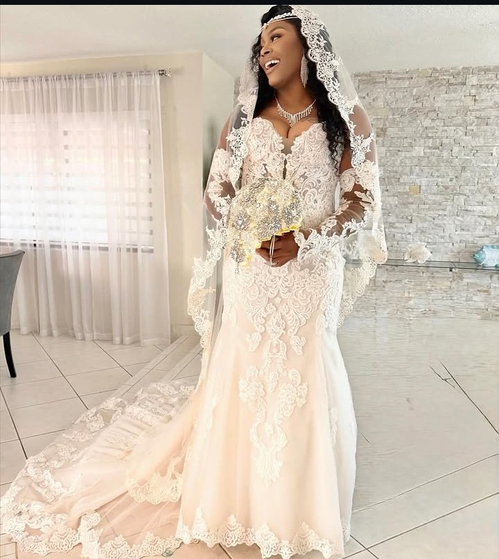 Bride in lace gown with soft bridal makeup